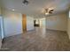 Open living room with tile floors, a ceiling fan, and a view into the kitchen at 1745 W Pollack St, Phoenix, AZ 85041