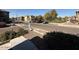 View of the neighborhood street and sidewalks with desert landscaping and a park at 1745 W Pollack St, Phoenix, AZ 85041