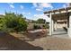 Backyard featuring desert landscaping, small shrubs, and block wall fence at 17813 W Primrose Ln, Surprise, AZ 85374