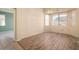 Dining room with wood-look flooring and plenty of natural light at 17813 W Primrose Ln, Surprise, AZ 85374