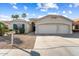 Charming home featuring a well-maintained yard and a spacious three-car garage at 17813 W Primrose Ln, Surprise, AZ 85374