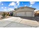 Charming home featuring a two-car garage and well-maintained landscaping at 17813 W Primrose Ln, Surprise, AZ 85374