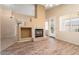 Stylish fireplace and lots of windows make this a cozy living space at 17813 W Primrose Ln, Surprise, AZ 85374