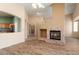 Open living space with brick fireplace at 17813 W Primrose Ln, Surprise, AZ 85374