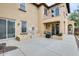 Large backyard featuring a stone fountain, stucco walls, and an outdoor seating area at 18256 W Carol Ave, Waddell, AZ 85355