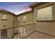 Balcony with a decorative railing and sunset views of the building at 18256 W Carol Ave, Waddell, AZ 85355