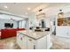 Large kitchen island with bar seating, granite countertop, and cabinetry at 18256 W Carol Ave, Waddell, AZ 85355