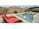 Relaxing poolside view with lounge chairs and refreshing water features, perfect for summer days at 18256 W Carol Ave, Waddell, AZ 85355