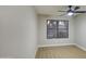 Bedroom with a window and a ceiling fan at 18359 N 88Th Ave, Peoria, AZ 85382