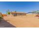 Spacious backyard featuring a block fence, and providing plenty of space for outdoor activities at 1841 N Wilbur Cir, Mesa, AZ 85201