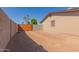 Spacious backyard with a block wall and a wood fence at 1841 N Wilbur Cir, Mesa, AZ 85201