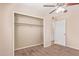 Bedroom featuring neutral walls, plush carpet, and a large closet with an open door at 1841 N Wilbur Cir, Mesa, AZ 85201