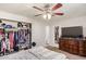 Bedroom featuring neutral walls, plush carpet, furnishings, and an open closet filled with clothes at 1841 N Wilbur Cir, Mesa, AZ 85201