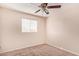 Bedroom featuring neutral walls, plush carpet, a ceiling fan, and a window with blinds at 1841 N Wilbur Cir, Mesa, AZ 85201