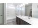 Bathroom featuring double sinks, and a shower-tub combination at 18783 N Avelino Dr, Maricopa, AZ 85138