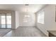 Bright, open dining area with tile floors and sliding glass doors at 18783 N Avelino Dr, Maricopa, AZ 85138