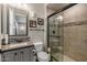 Bathroom with single sink vanity and glass enclosed shower at 1899 E Everglade Ln, Gilbert, AZ 85298