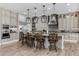 Well-appointed kitchen with an island, pendant lighting, and custom cabinetry at 1899 E Everglade Ln, Gilbert, AZ 85298