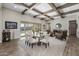 Open-concept living space with exposed beam ceiling, modern furnishings, and abundant natural light at 1899 E Everglade Ln, Gilbert, AZ 85298