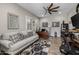 Inviting home office space with decorative rug, a ceiling fan, and natural light at 1899 E Everglade Ln, Gilbert, AZ 85298