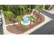 Aerial view of a community pool surrounded by palm trees at 1911 E Hartford Ave, Phoenix, AZ 85022