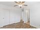 Bedroom with wood-style flooring, closet and doorways to other rooms at 1911 E Hartford Ave, Phoenix, AZ 85022