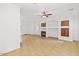 Open living room with tile floors, fireplace, and built-in wooden shelves at 1911 E Hartford Ave, Phoenix, AZ 85022