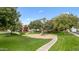 Community playground with mature trees and green lawns at 1911 E Hartford Ave, Phoenix, AZ 85022