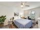 Cozy bedroom featuring a bed, desk, and window, creating a comfortable and inviting space at 19236 N 22Nd Ln, Phoenix, AZ 85027