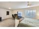 Large bedroom featuring a TV area with natural light and neutral carpet, ideal for relaxation at 19236 N 22Nd Ln, Phoenix, AZ 85027