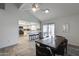 Bright dining area adjacent to a modern kitchen, featuring tile floors and seamless indoor-outdoor living at 19236 N 22Nd Ln, Phoenix, AZ 85027