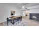 Stylish dining space with modern furnishings, tile flooring, and a view of the contemporary fireplace at 19236 N 22Nd Ln, Phoenix, AZ 85027