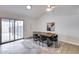 Cozy dining area with tile floors, vaulted ceiling, and sliding glass doors offering backyard views at 19236 N 22Nd Ln, Phoenix, AZ 85027