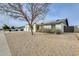 View of a home's front exterior, featuring low-maintenance landscaping and blue skies at 19236 N 22Nd Ln, Phoenix, AZ 85027