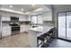 Bright kitchen featuring stainless steel appliances, white cabinets and quartz countertops at 19236 N 22Nd Ln, Phoenix, AZ 85027