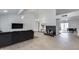 Spacious living room featuring a vaulted ceiling, tile floors, fireplace, and ample natural light at 19236 N 22Nd Ln, Phoenix, AZ 85027