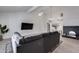 Inviting living room featuring high ceilings, a modern fireplace, comfortable seating, and tile flooring at 19236 N 22Nd Ln, Phoenix, AZ 85027