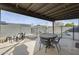 Relaxing covered patio with dining table, chairs, and view of the fenced backyard pool area at 19236 N 22Nd Ln, Phoenix, AZ 85027