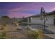 Backyard pool features desert landscaping with rock features, pebble ground cover, and privacy fencing at 19236 N 22Nd Ln, Phoenix, AZ 85027