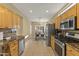 Bright kitchen featuring stainless steel appliances, granite countertops, and ample cabinet storage at 19460 N Hidden Canyon Dr, Surprise, AZ 85374