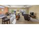 Cozy living room with neutral tones, comfortable seating, and ample natural light from sliding glass doors at 19460 N Hidden Canyon Dr, Surprise, AZ 85374