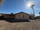 Back exterior elevation, the house has a gravel filled yard at 1954 W Kerry Ln, Phoenix, AZ 85027