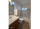 Bathroom with neutral colors, tiled floors, shower-tub combo, and a single sink vanity at 1954 W Kerry Ln, Phoenix, AZ 85027