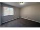 Bedroom with neutral walls, carpeted floor, and a window with blinds at 1954 W Kerry Ln, Phoenix, AZ 85027