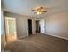 Bedroom with a large closet, neutral walls, carpeted floor, and an open door to the bathroom at 1954 W Kerry Ln, Phoenix, AZ 85027