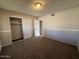 Neutral-carpeted bedroom with double closet doors at 1954 W Kerry Ln, Phoenix, AZ 85027