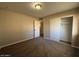 Bedroom with a large closet, neutral walls, carpeted floor, and a light at 1954 W Kerry Ln, Phoenix, AZ 85027