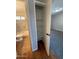 View into hallway closet with white shelving; bathroom visible at 1954 W Kerry Ln, Phoenix, AZ 85027