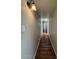 Hallway with classic wood-look laminate flooring and neutral walls at 1954 W Kerry Ln, Phoenix, AZ 85027