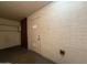 Well-lit mud room area featuring brick walls and neutral door at 1954 W Kerry Ln, Phoenix, AZ 85027